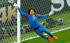 6.+Mexico's+Guillermo+Ochoa+jumps+to+save+the+ball+during+their+2014+World+Cup+Group+A